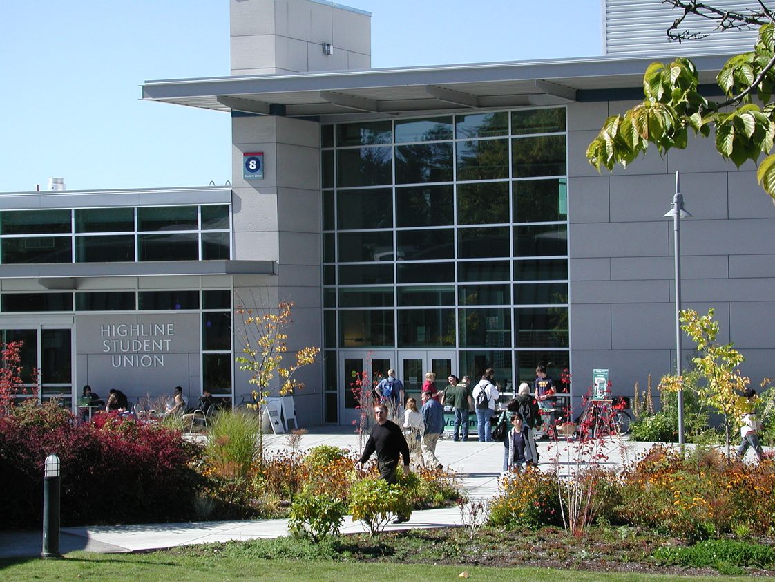 Highline's Student Union Building 8 on a sunny summer day with students walking across campus.